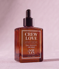 30ml square glass dropper bottle of Crew Love Lux Oil Blend premium home fragrance on a soft pink pastel background.