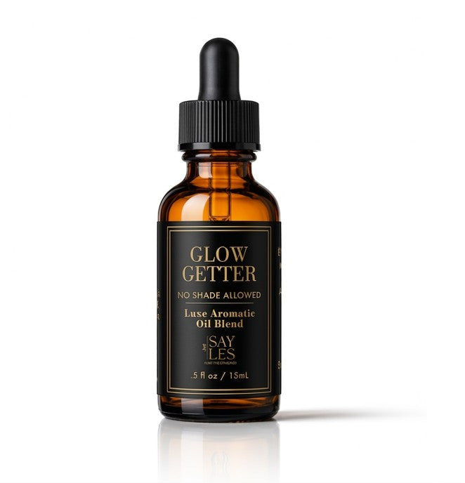 15ml amber glass dropper bottle of Glow Getter Lux Oil Blend luxury diffuser oil on a clean white background.