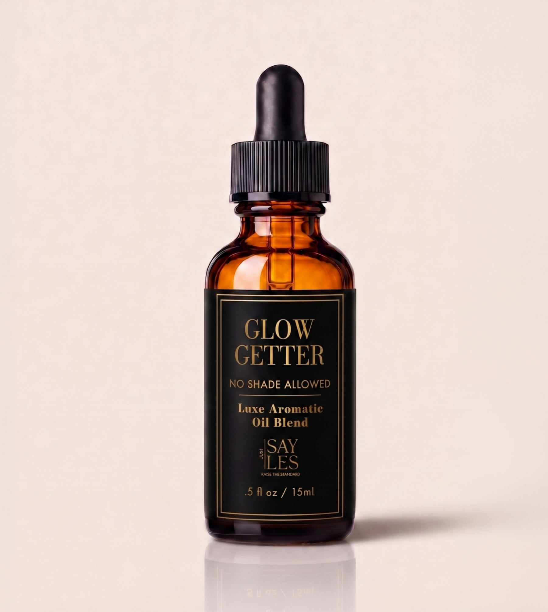 15ml amber glass dropper bottle of Glow Getter Lux Oil Blend luxury diffuser oil on a clean white background