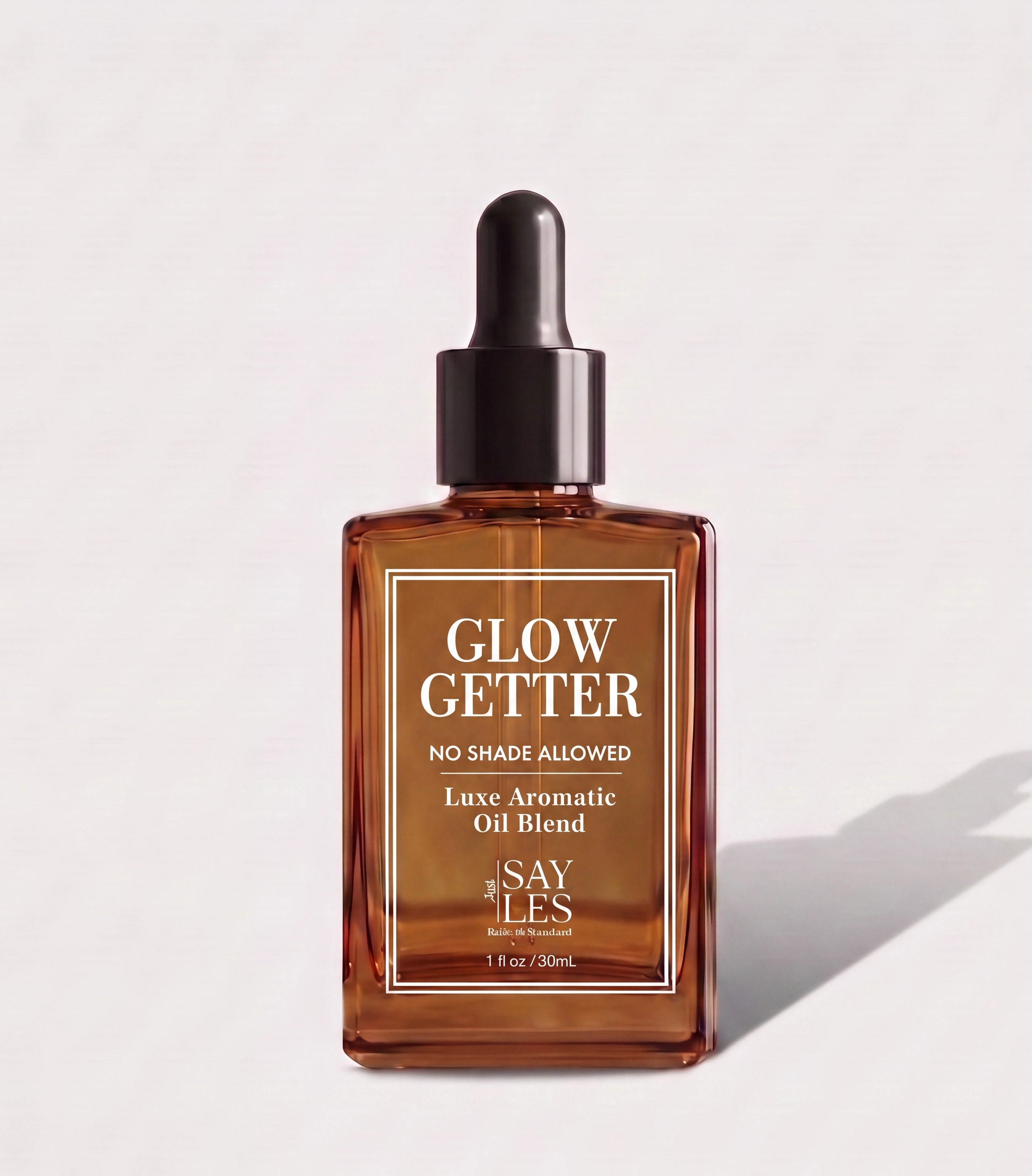 30ml square glass dropper bottle of Glow Getter Lux Oil Blend premium home fragrance on a minimalist light background with a soft shadow