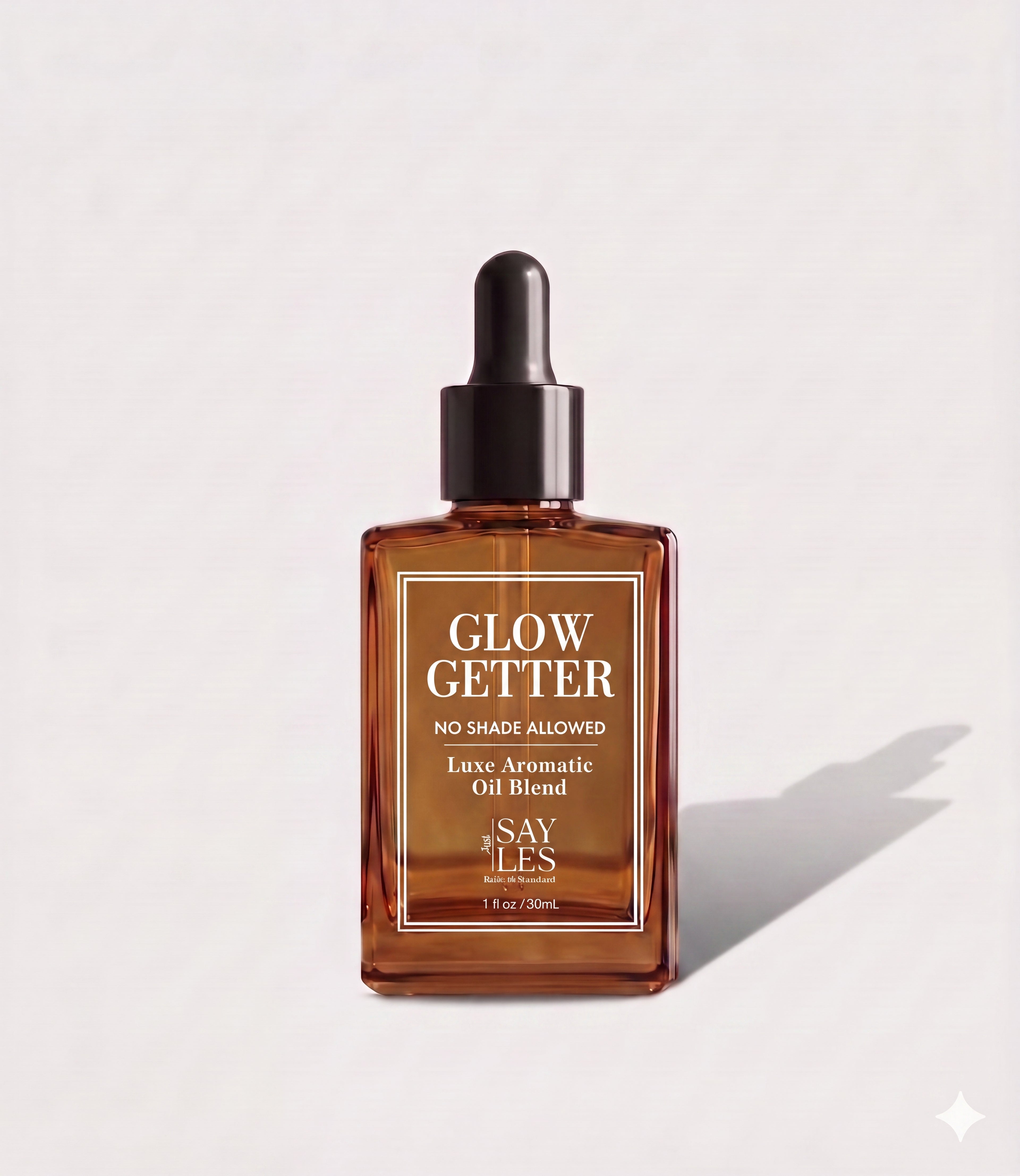 30ml square glass dropper bottle of Glow Getter Lux Oil Blend premium home fragrance on a minimalist light background with a soft shadow.