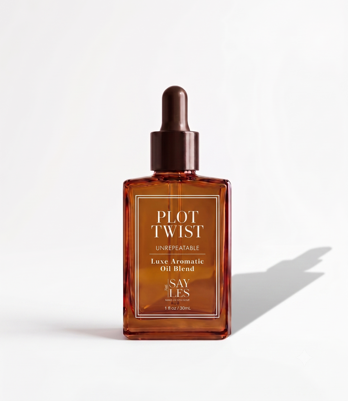 30ml glass dropper bottle of Plot Twist Lux Oil Blend luxury home fragrance on a minimal background.